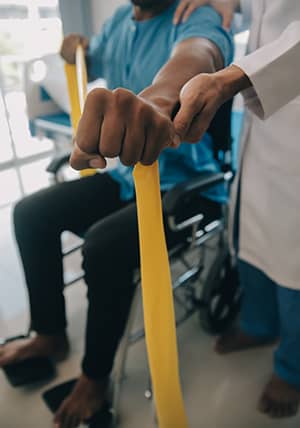 man in wheelchair using band